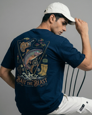 Toneos 'Bait the Beast' navy blue t-shirt featuring a colorful trout, fishing rod, fishing beast graphic and vintage outdoor gear illustrations.